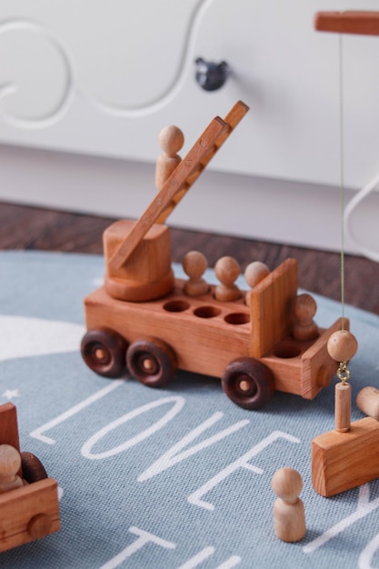 Retro wooden baby boy cars in the interior of nursery room