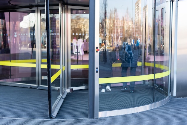 Revolving glass door on modern corporate building.