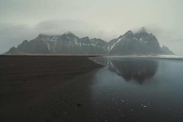 Reynisfjara beach against mountains landscape photo