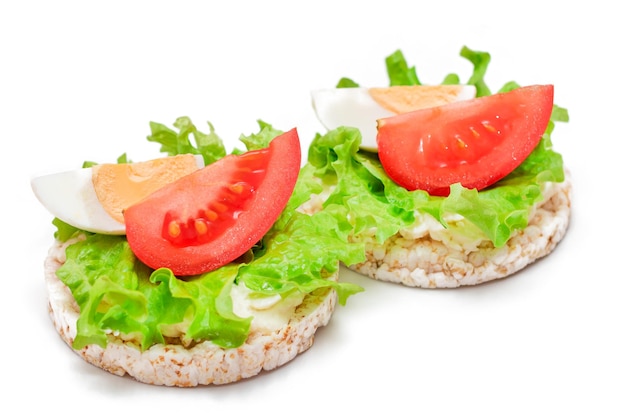 Rice cake sandwiches with tomato lettuce and egg  isolated