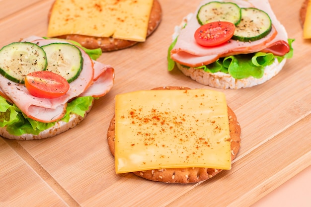 Rice cakes with ham tomato fresh cucumber green salad and cheese