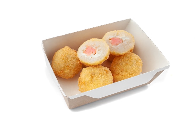 Rice croquettes with cottage cheese and salmon in breadcrumbs. Deep-fried. Delivery box. Close-up. White background. Isolated.