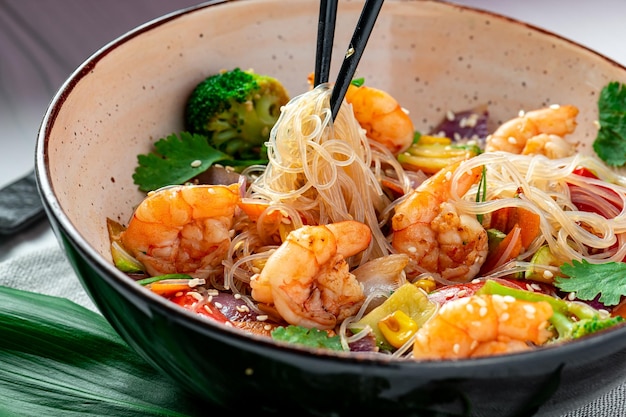 Rice noodles with shrimp and vegetables Asian cuisine