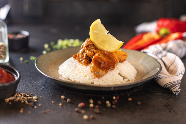 rice with meat spices curry chicken tomato sauce Indian cuisine meal snack on the table copy space