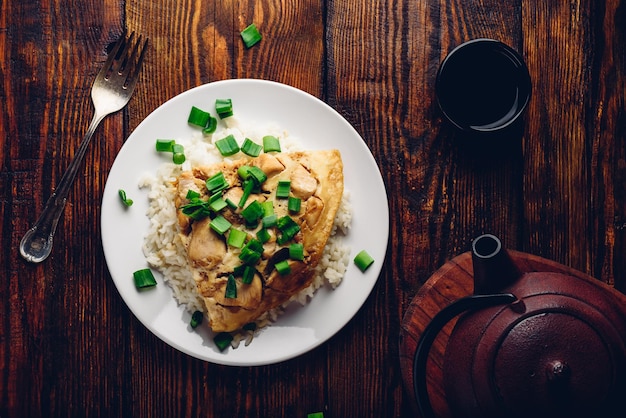 Rice with scrambled eggs chicken and green onion