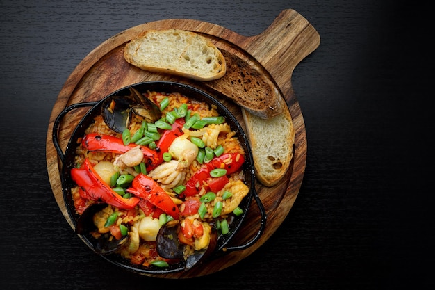 Rice with vegetables and seafood in a pan