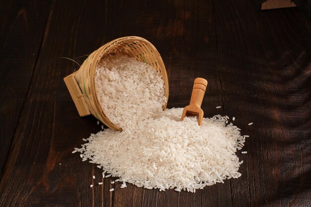 Rice on wooden background close up