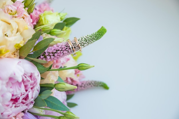 Rich bunch of pink peonies and lilac eustoma roses flowers green leaf Fresh spring bouquet Holodays giftArrangement of Beautiful blossoming flowerswedding bouquetcopy space