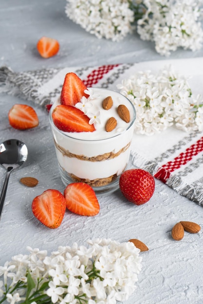 Ricotta dessert with fresh strawberries Healthy breakfast of yogurt strawberry and almonds