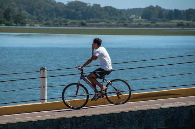 Riding a bicycle over a bridge