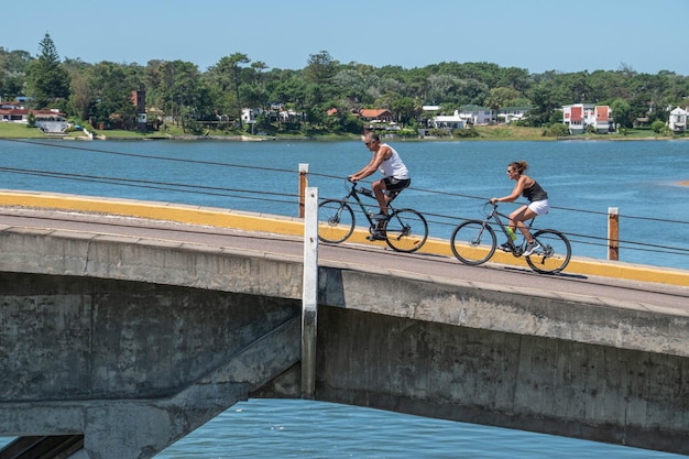 Riding a bicycle over a bridge