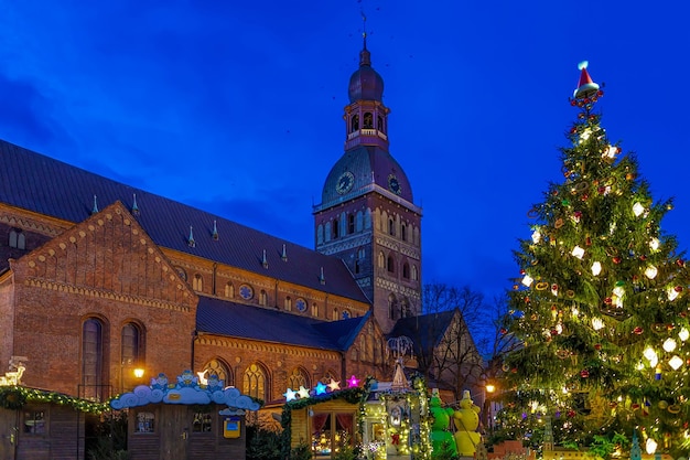 Riga cathedral near the Christmas market in old Riga, Latvia. The cathedral was built in 1211 by Livonian Bishop Albert of Riga. It is the largest medieval cathedral in Baltic states.