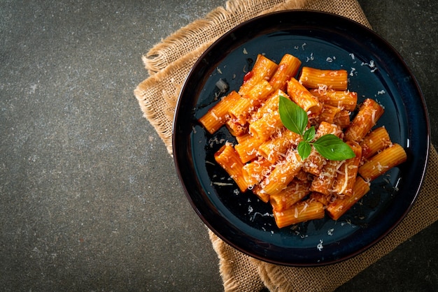 Rigatoni pasta with tomato sauce and cheese traditional Italian pasta