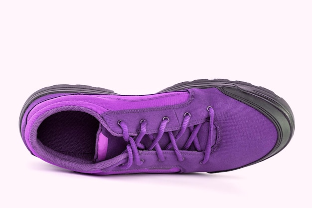 Right cheap purple hiking or hunting shoe isolated on white background view from above