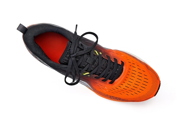 Right orange running shoe isolated on white background Top view with copy space