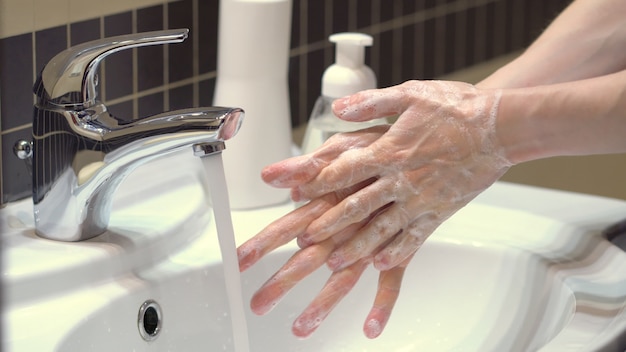 The right technique for good hand hygiene to protect yourself from the germs and the Covid19 coronavirus. Close up view.