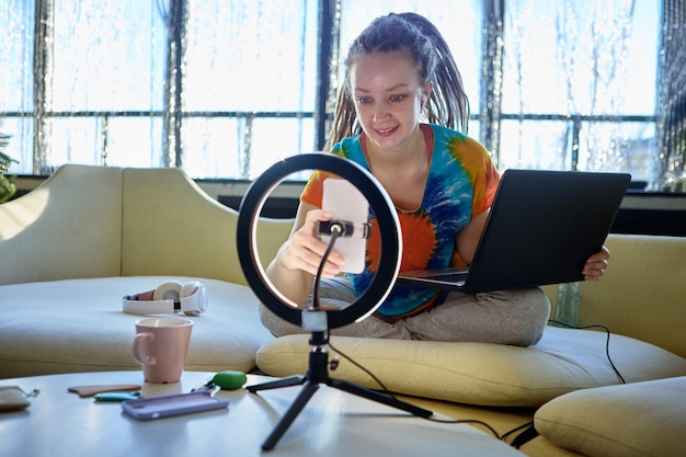 Ring light with cell phone holder for beauty blogger during video making