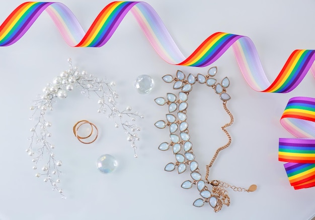 Rings and accessories for lesbian wedding on white background