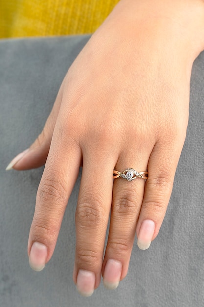 Rings on hands young bride wearing a beautiful engagement ring