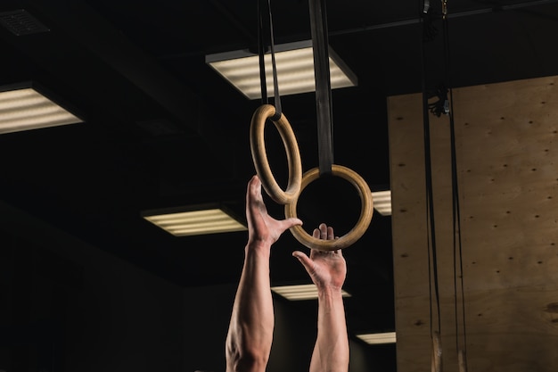 Photo rings suspended on straps on crossfit gym