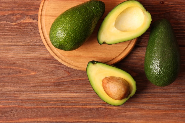 Ripe avocado closeup on a colored background