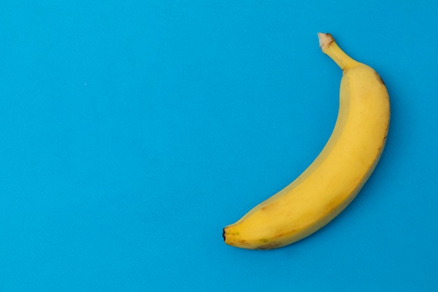 Ripe banana with a blue background