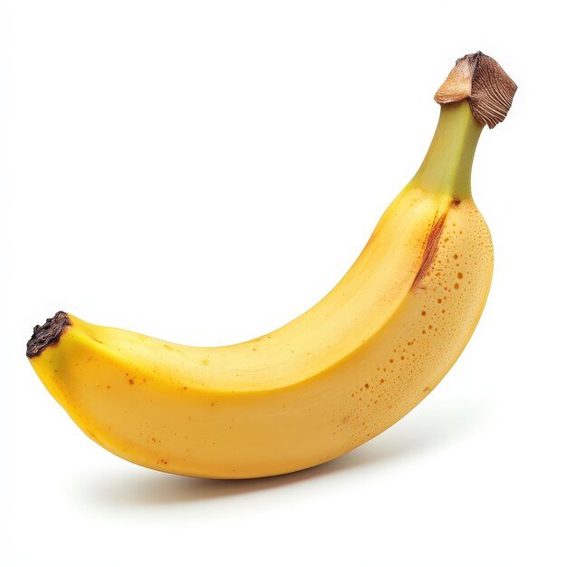 A ripe banana with a smooth yellow peel resting on a plain background