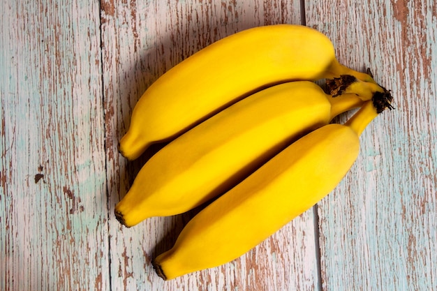 Ripe banana over wooden surface