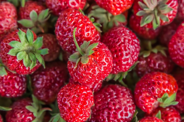 Ripe bright strawberries as a background