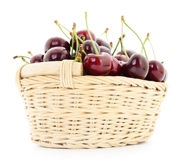 Ripe cherries in basket on a white background.