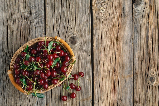 Ripe cherries on wooden table.