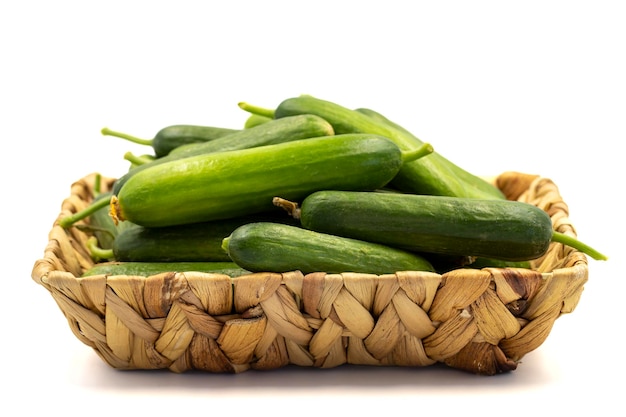 Ripe cucumber Fresh cucumbers in basket isolated on white background Organic food close up