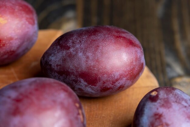 Ripe delicious plums of dark color harvested ripe plums for storage and production of prunes