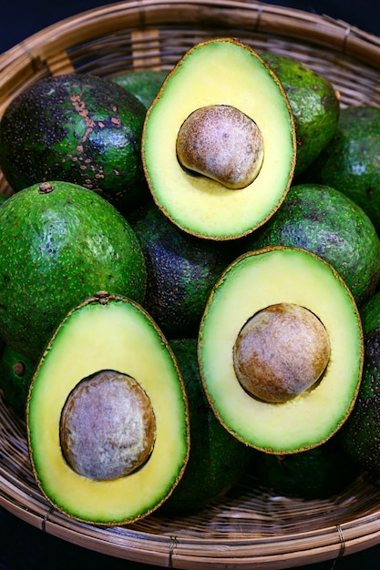 Ripe fresh avocado in bamboo basket