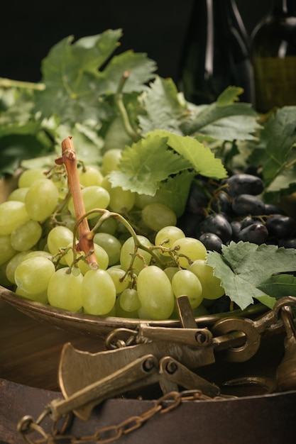 A ripe grapes on old scales rustic style