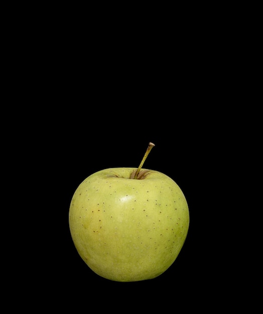 Ripe green apple on a black backgroundxA