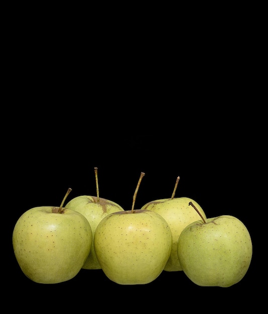 Ripe green apples on black background