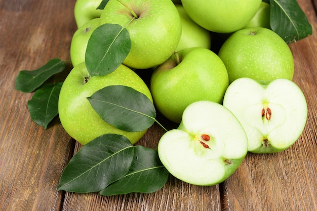 Ripe green apples on wooden background