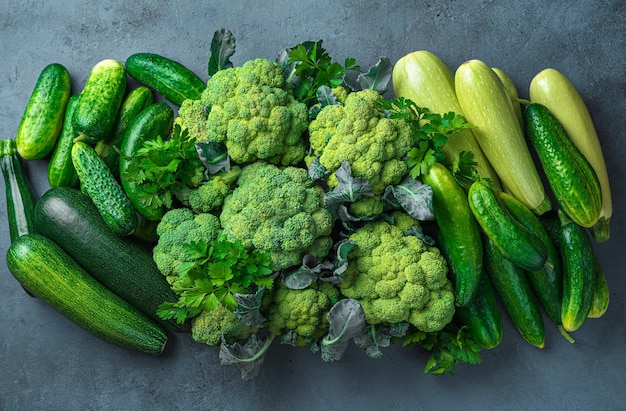 Ripe green vegetables on a graphite background Healthy vegetarian food