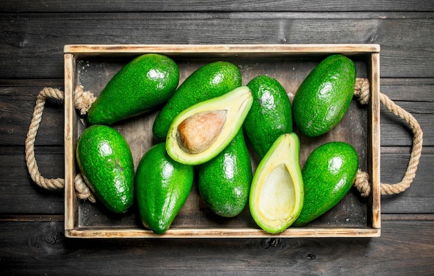 Ripe juicy avocado on the old dressing