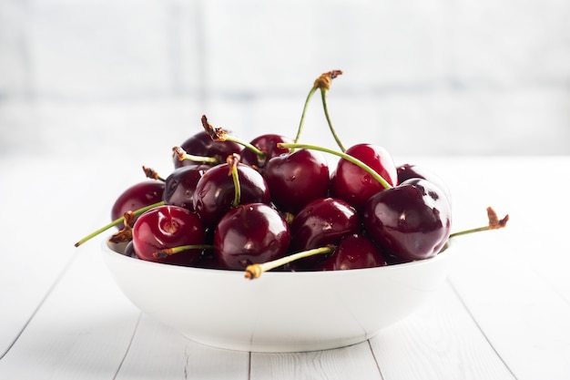 Ripe juicy cherry berries on a plate