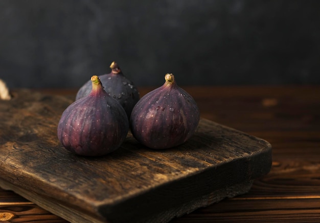 ripe juicy fig on wooden table