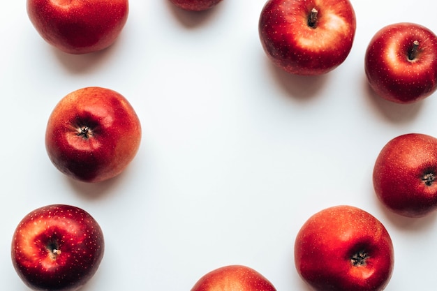 Ripe juicy red rayal gala apples on grey backgroung top view autumn composition