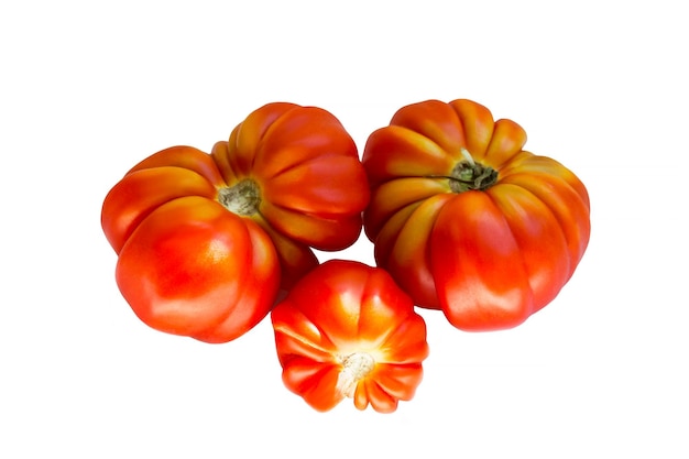 Ripe juicy red ribbed tomatoes of the Minusinsky sharpei variety Natural products and vitamins Isolated on white background Closeup