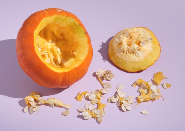 Ripe large orange pumpkin was cut out and a lot of seeds take out of it Idea autumn harvest and benefits vegetablesxAxA