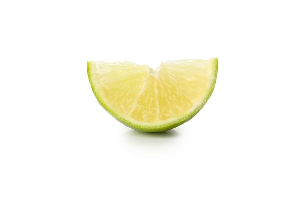 Ripe lime slice isolated on white background