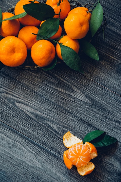 Ripe mandarin fruit on old rustic table