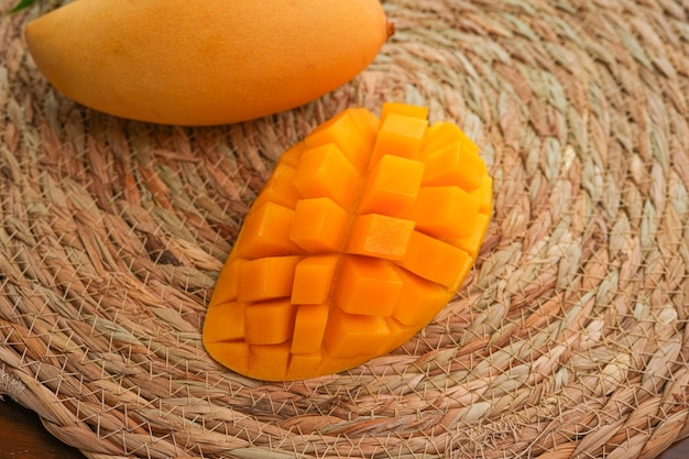 Ripe mango on woodRipe Mango Slice on wooden cutting board