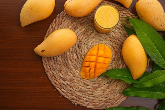 Ripe mango on woodRipe Mango Slice on wooden cutting board