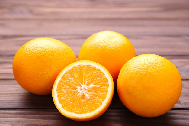 Ripe orange fruit on a brown background